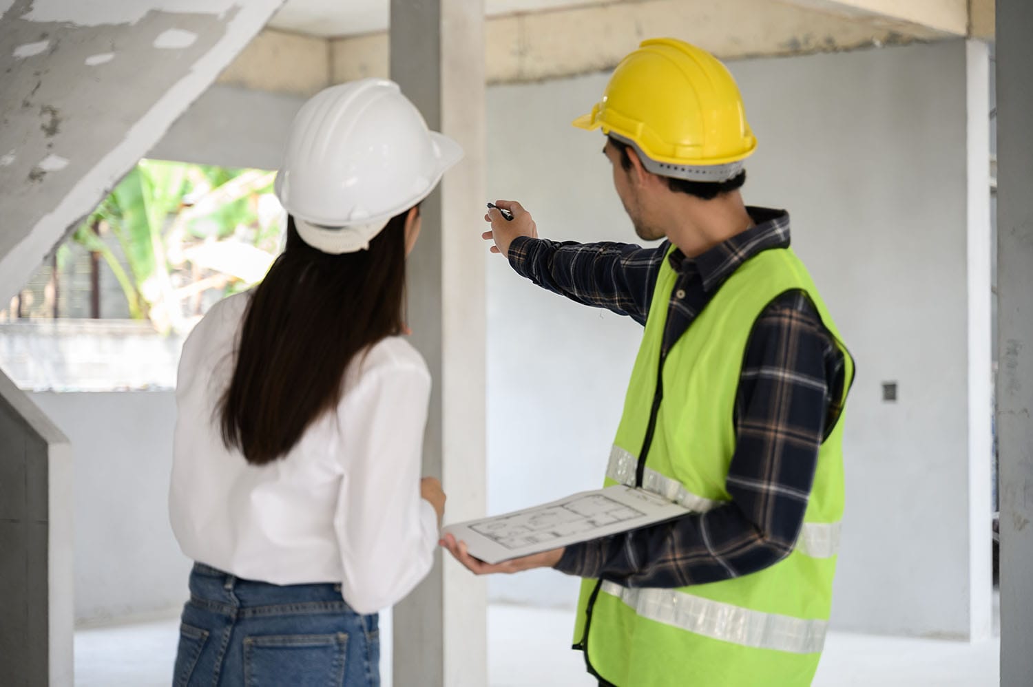 Man and woman inspecting a room